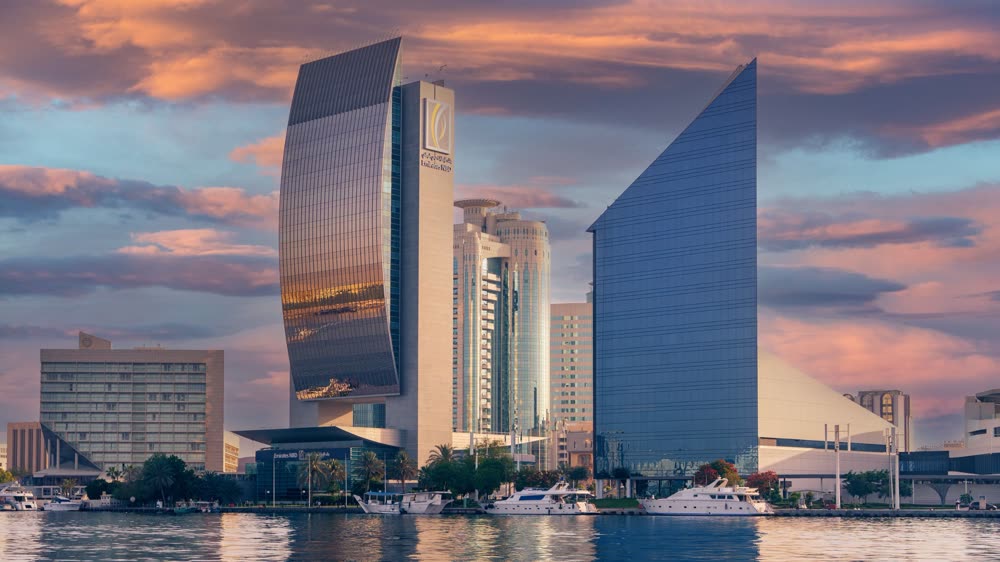 Dubai skyline towers at sunset over the creek, representing UAE mainland business setup