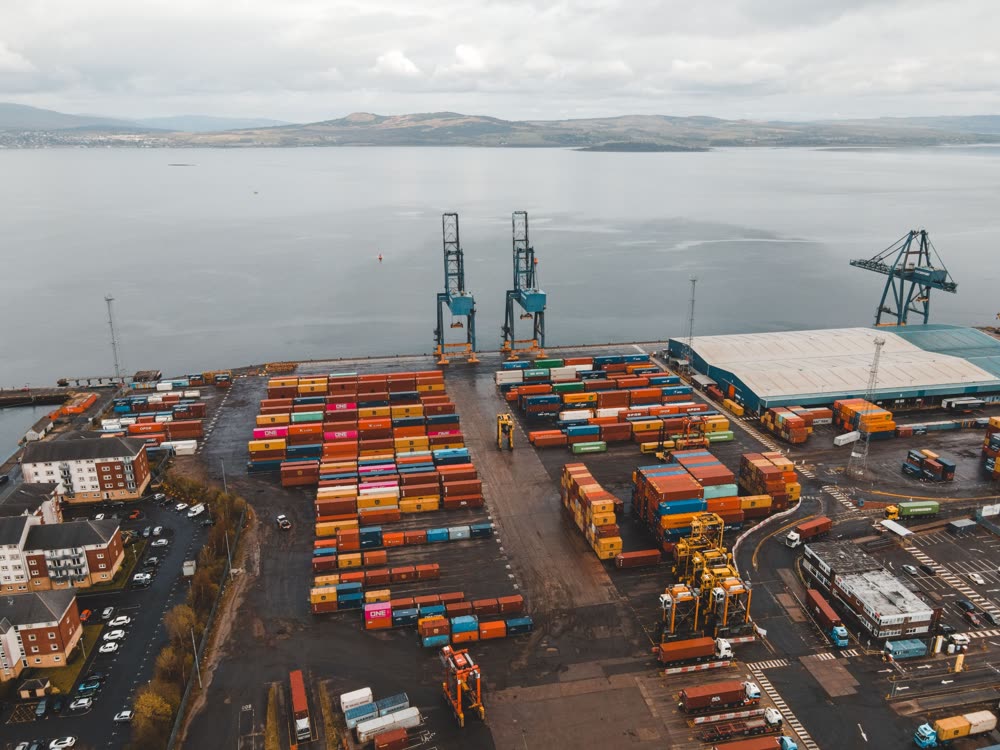 Container port beside open water, representing offshore company formation and international trade